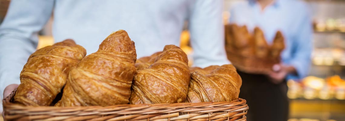 Close up of just baked croissants lying in the box