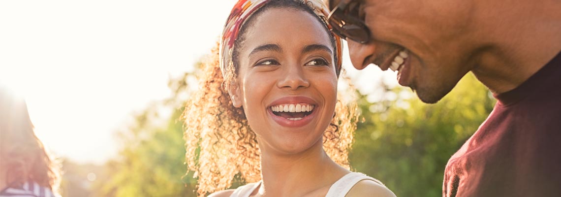 young woman laughing with male friend