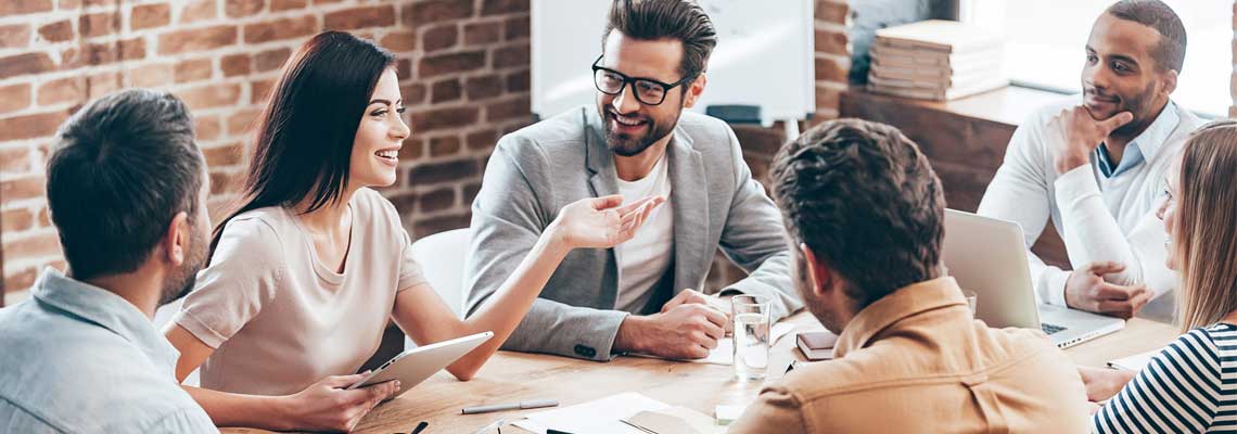 woman discussing something with her co-workers in the office