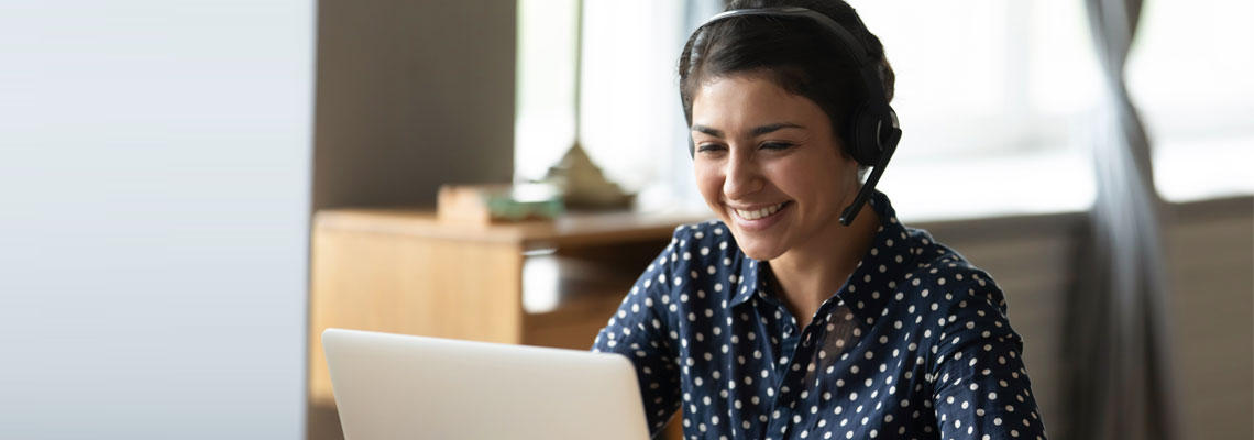 woman sitting at desk having a video call