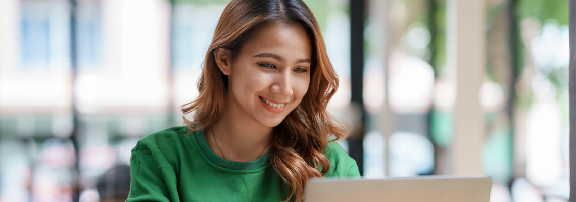 Asian businesswoman using laptop in the office