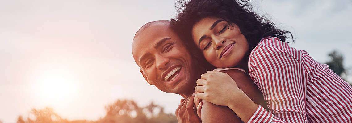 Couple hugging and smiling