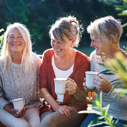 Senior women drinking coffee and smiling