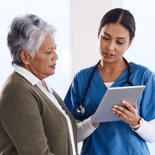 female doctor taking to a patient